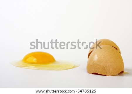 eggs with one of them cracked open, positioned against a white background