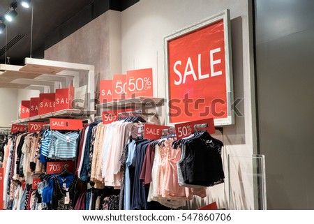 Sale label sign in front of shop,Sale shopping season for discount display,Sale marketing business advertisement for clearance shop,Sale sign or label most use red color for tell customer.