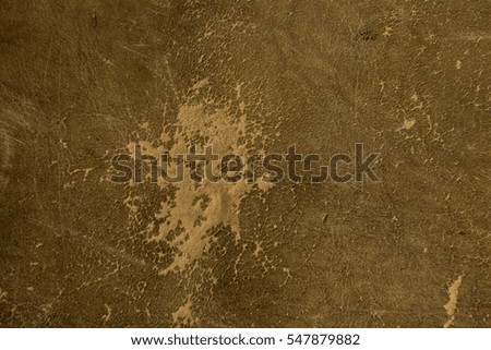 old worn textured leather background in yellow and brown