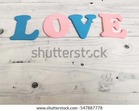 Love background with empty space for your logo. Sweet love wooden letters. Valentines day. Valentines 2017. Love day. Love word background for your text.  