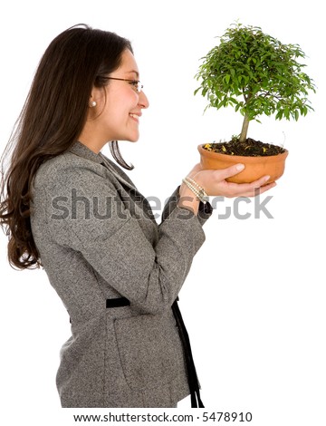 business woman holding a bonsai tree isolated over a white background