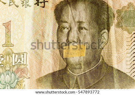 Portrait of the communist revolutionary Mao Zedong with mouth closed on the banknote of Chinese Yuan, as a symbol of the instability of the modern economy