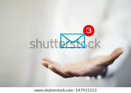 mail marketing concept with mail letter icons on hand , business concept , business idea