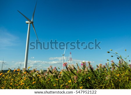 Image of wind turbine for produce wind energy with blue sky