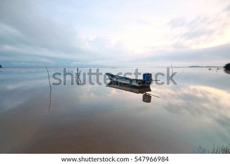 beautiful landscape view with sunrise and fisherman boat