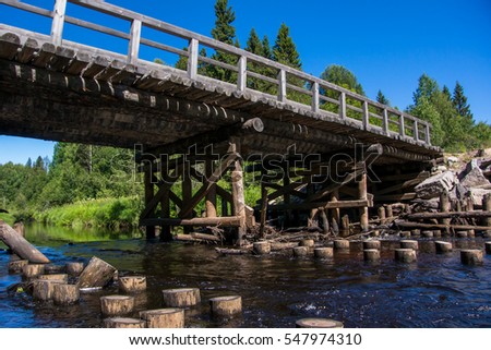 Wooden bridge across the river in Karelia. Pudozhsky district, Ragnuksa river