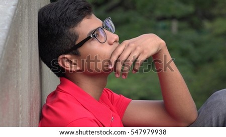 Intelligent Teen Hispanic Boy Thinking Royalty-Free Stock Photo #547979938