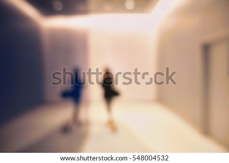 Silhouette Blurred people walking  in a dark dramatic mysterious background