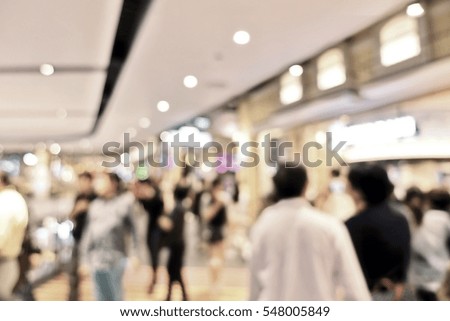 Blurred people at shopping mall go shopping