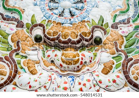 The texture of a wall in a Buddhist temple in Asia ceramic tile. The Colorful of ceramic background texture. Asian background concept