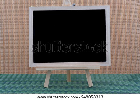 Clean chalk board on wooden wall for background. texture for educational or business background.
