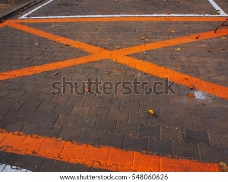 Dark grey asphalt background with Orange Line 
