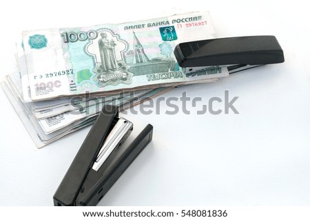 Two stapler and money. Ruble strengthening Concept