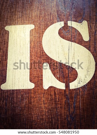 Wooden alphabet letter I, S, IS. Written letter with paint on a wooden background. Alphabet wood texture.