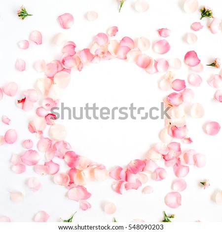 Frame made of pink roses petals on white background. Flat lay, top view. Valentine's background. Valentine's Day concept.
