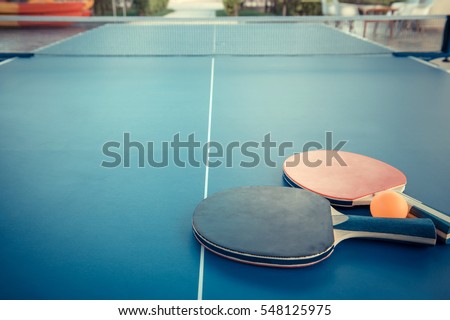 Tabletennis or ping pong rackets and balls on table. Sport concept. Royalty-Free Stock Photo #548125975