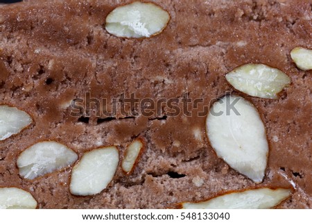 A macro photo of the surface of almond nougat from France.