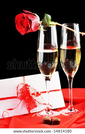 beautiful rose, champagne  and letter with ribbon close up