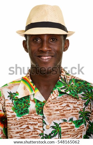 Face of young happy black African man smiling isolated against white background