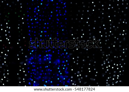 Abstract night background blur of blue and white points of light