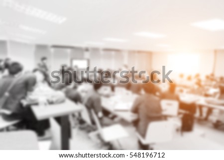 Blurred picture of student during study or exams from teacher,professor in classroom at university. Abstract background people learning,testing,training group. Lecture,meeting about education.