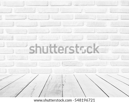White brick wall background with wood floor foreground. gray texture stone concrete,rock,cement plaster stucco; paint pastel masonry block pattern; Construction architecture indoor design modern room.