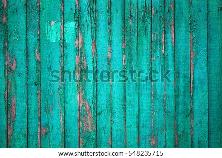 Texture of old wooden fence painted in green