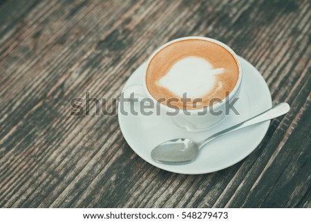 Cup of hot latte  on wooden table in coffee shop cafe - Vintage effect style pictures