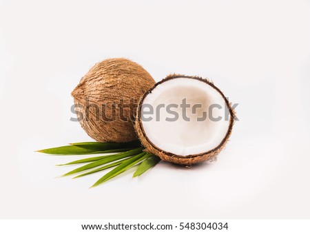 Coconut with half and leaves on white background. Royalty-Free Stock Photo #548304034