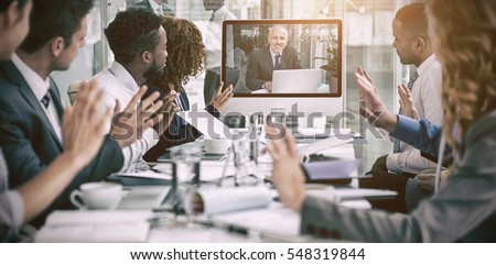 Business people looking at screen during video conference in office Royalty-Free Stock Photo #548319844