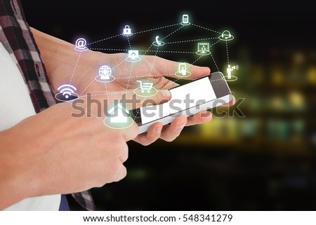 Cropped image of man using smartphone against illuminated city by lake 3d