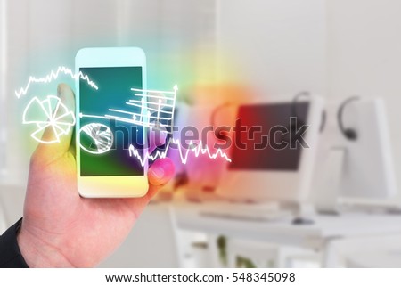 Hand of businessman holding smart phones against computers and headsets 3d