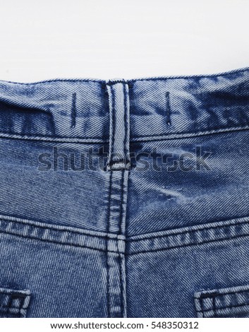 Details back blue jeans-white background