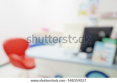 Blur abstract background inside empty patient examination room for kid with bed in OPD ward. Blurry doctor desk for diagnosis sick people woking space in hospital. Defocused interiors healthcare place