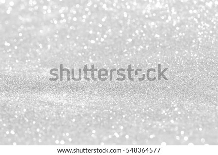 silver and white bokeh lights defocused. abstract background Royalty-Free Stock Photo #548364577