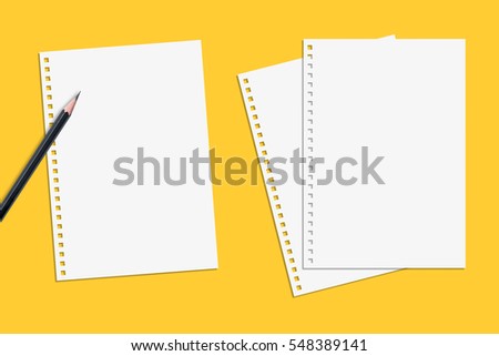 Blank paper notepad from spiral notebook with a black pencil. It has been isolated on yellow background.