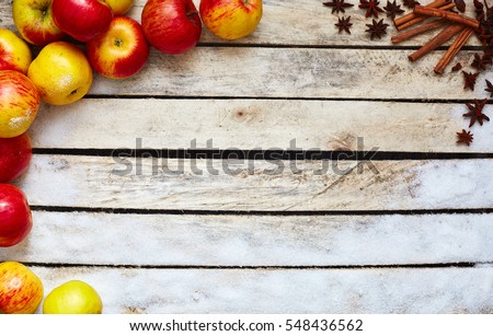 Some red and yellow apples, sugar, kitchen herbs on the white wooden table. food and dietary concept. picture with free space for text
