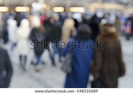 Abstract background blur of people in the town square
