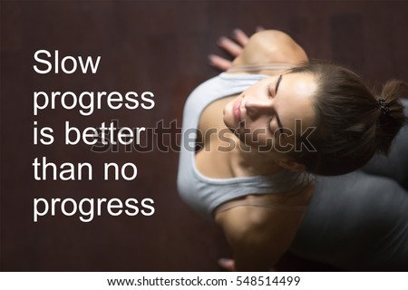 Fit woman doing yoga or pilates exercise working out in home interior. Fitness motivation quote with motivational text "Slow progress is better than no progress". Healthy lifestyle concept