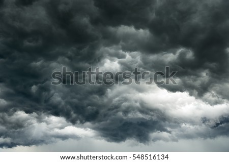 Rain clouds background.Clouds become dark gray like a big smoke before rainfall.Thunderstorm is a storm with lightning and thunder. Air pilots know that they must never fly through a thunder cloud.  Royalty-Free Stock Photo #548516134