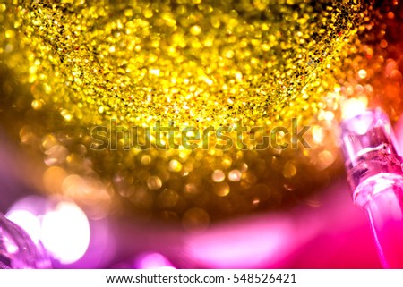 Abstract, blurry, vibrant and colorful background. A shot of Christmas decorations and lights on a lit Christmas Tree