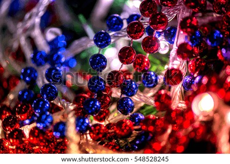 Abstract, blurry, vibrant and colorful background. A shot of Christmas decorations and lights on a lit Christmas Tree