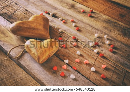 Valentines day background. hearts on wooden table.