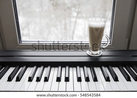 electronic piano in the interior near the window