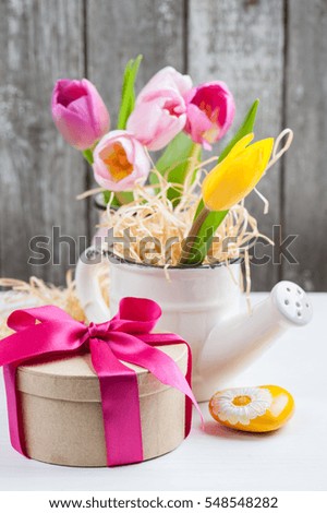 Bunch of magenta pink yellow tulips on rustic wooden background, pastel flower pots, Happy Mothers day or Valentine Card