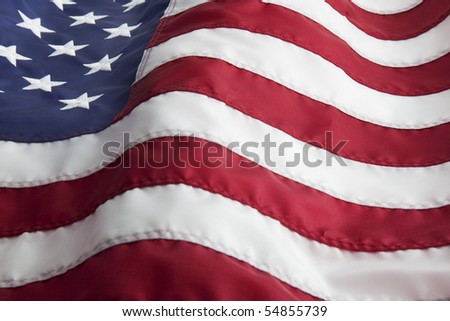 Detail of the United States of America flag waving in the wind.