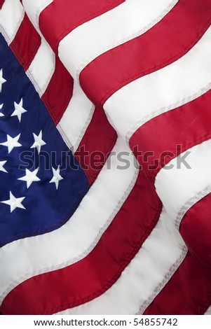 Detail of the United States of America flag waving in the wind.