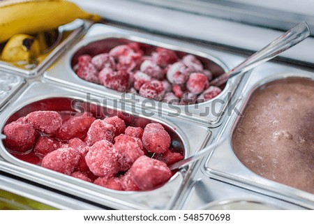 Frozen raspberries and strawberries for ice cream