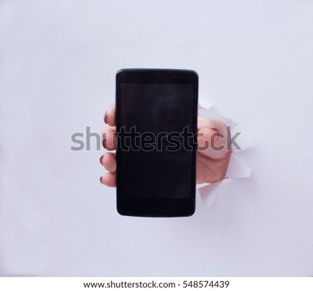 hand holding black phone isolated on white background 