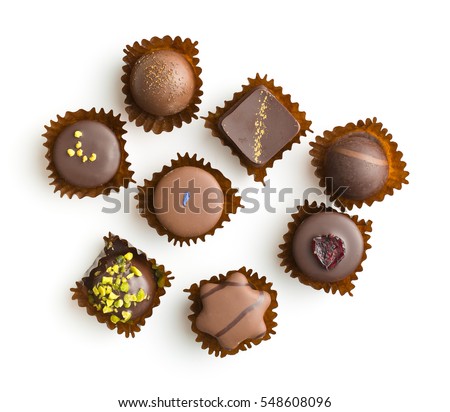 Various chocolate pralines isolated on white background. Top view. Royalty-Free Stock Photo #548608096